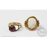 A cameo set ring, the oval shell cameo depicting a bearded man in profile, within rub-over setting,