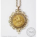 A George V 1913 full sovereign, within 9ct yellow gold mount and attached chain stamped '9ct', 17.