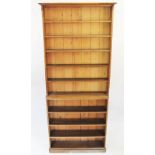 A Victorian golden oak two section library bookcase,