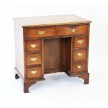 A George III style yew wood desk,