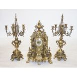 A German gilt metal rococo style clock garniture,