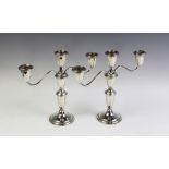 A pair of candelabra stamped 'Sterling',