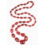 A 'Cherry' amber single strand bead necklace,