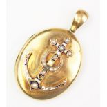 A Victorian sentimental locket, the yellow metal oval locket set with an anchor