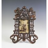 A 19th century style copper oxidised openwork easel frame,