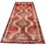 A large antique washed Persian Heriz runner,