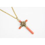A Victorian coral set cross pendant and chain, the coral set cross centred by a foliate spray