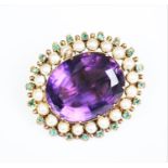 An early 20th century brooch in Suffragette colours, designed as a central claw set amethyst,