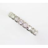 A diamond set half eternity ring,