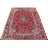 A large Persian Kashan carpet,