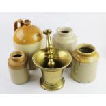 A polished bronze pestle and mortar of large proportions,