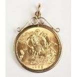 An Elizabeth II gold sovereign dated 1962, within a 9ct gold mount,
