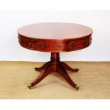 A Regency style reproduction mahogany circular drum table,