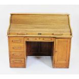An Edwardian golden oak roll top desk,