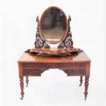 A Victorian mahogany dressing table and associated dressing mirror,