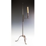 An Arts & Crafts style wrought iron adjustable candle stand,