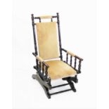 A late 19th century American walnut rocking chair,