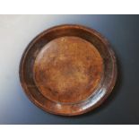 A large 19th century carved elm bowl,