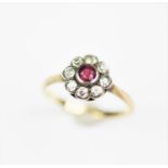 An Edwardian ruby and diamond daisy cluster ring,