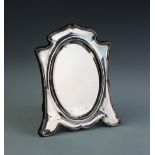 An Edwardian silver dressing table mirror,