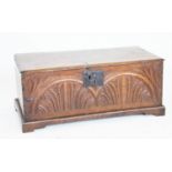 A late 17th century carved oak coffer,