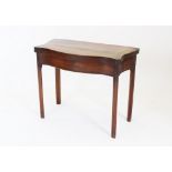 A George III mahogany serpentine card table,