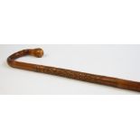 Two Japanese carved bamboo walking canes,