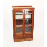 An Edwardian oak two door bookcase,