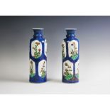 A pair of Chinese porcelain rouleau vases,