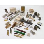 A collection of early 20th century, cigarette lighters, table lighters, pocketknives,
