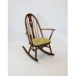 An Ercol stained beech wood rocking chair,