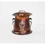 An early 20th century Art Nouveau planished copper coal scuttle and cover,