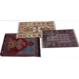 An ethnic hand knotted rug of small proportions