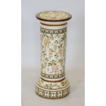 A Minton style ceramic jardiniere stand, of cylindrical column form on plinth base,