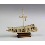 A Chinese carved ivory model of a junk,