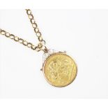 An Edwardian gold sovereign dated 1908, within 9ct gold mount,