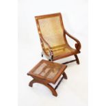 A Regency style walnut bergere library chair,