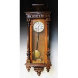 A Victorian walnut twin weight Vienna regulator wall clock,