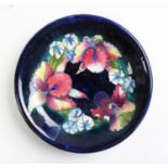 A Moorcroft Orchid and Spring Flowers pattern plate,