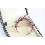 A Victorian ruby and diamond crescent brooch,