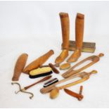 A selection of vintage boot trees, shoe lasts and dress brushes,