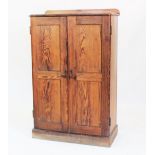 A Victorian pitch pine two door cupboard,
