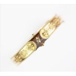 A Victorian 9ct gold hinged bangle,