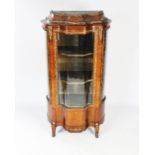 A late 19th century French serpentine kingwood vitrine,