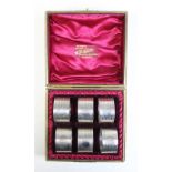 A George V set of six silver napkin rings,