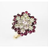 A diamond and untested ruby cluster ring