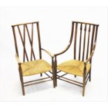 Two early 20th century Arts and Crafts beech wood elbow chairs,