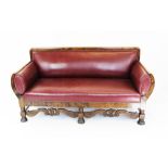 A Danish red leather upholstered beech library settee,