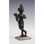 An Indian bronze model of Krishna,
