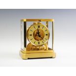 A Swiss Brass Atmos Clock, signed Jaeger LeCoultre,